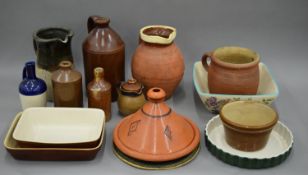 A quantity of stoneware and earthenware pottery.