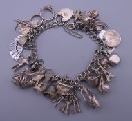 A silver charm bracelet. 52 grammes total weight.