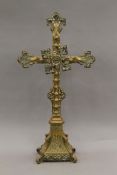An ornate Victorian brass altar cross. 75 cm high.