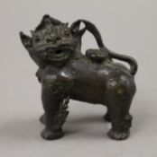 An 18th/19th century bronze small dog-of-fo water dropper. 8 cm long.