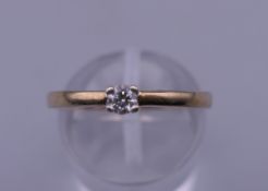 A 9 ct gold brilliant cut diamond solitaire ring. Ring size N/O. 2.1 grammes total weight.