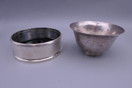 An Oriental planished silver bowl and Scandinavian silver coaster. The latter 10 cm diameter.