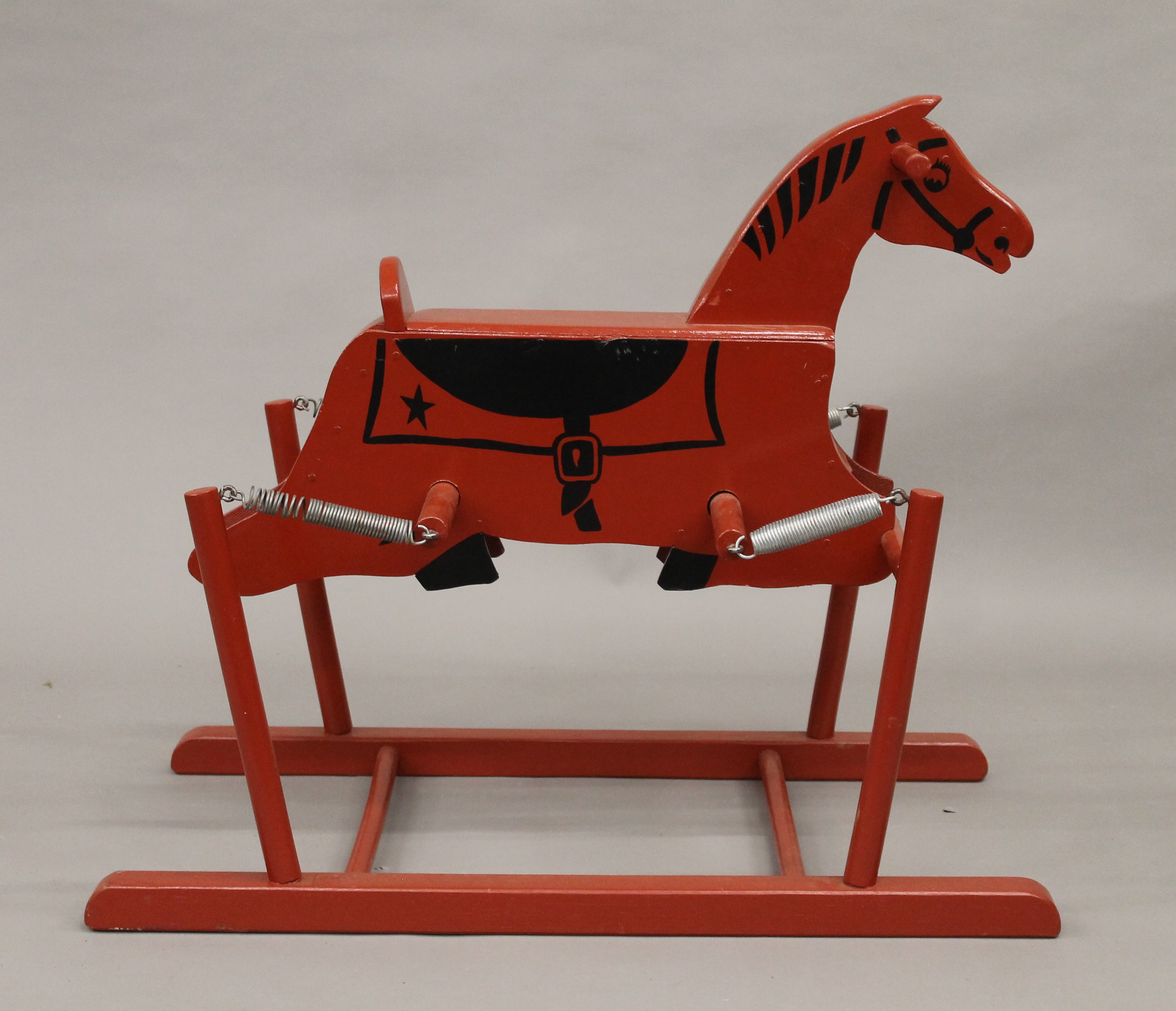 A vintage red painted rocking horse. 74 cm high. - Image 2 of 3