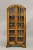 An early 20th century lead glazed bookcase. 60.5 cm wide.