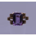 A 14 ct gold and amethyst ring. Ring size K. 3 grammes total weight.