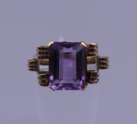 A 14 ct gold and amethyst ring. Ring size K. 3 grammes total weight.