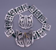 A silver Art Nouveau belt and matching buckle. Approximately 46 cm long.