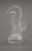 A Lalique glass sea horse, the underside signed Lalique (R) France. 9.5 cm high.