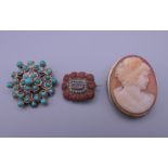 An unmarked gold turquoise set brooch, a small 19th century mourning brooch and a cameo brooch.