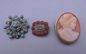 An unmarked gold turquoise set brooch, a small 19th century mourning brooch and a cameo brooch.