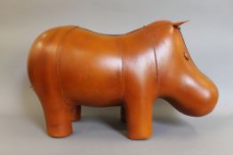 A tan leather hippopotamus form stool. 58 cm long.