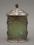 A silver mounted cylindrical jade lidded box. 12.5 cm high.