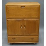 A blonde Ercol cocktail cabinet. 82 cm wide.