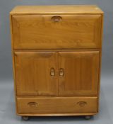 A blonde Ercol cocktail cabinet. 82 cm wide.