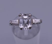 An 18 ct white gold dress ring. Ring size N. 5.4 grammes total weight.