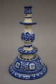 A blue and white tin glaze pottery candlestick. 24 cm high.