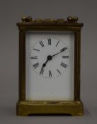 A late 19th/early 20th century French brass carriage clock. 14 cm high.