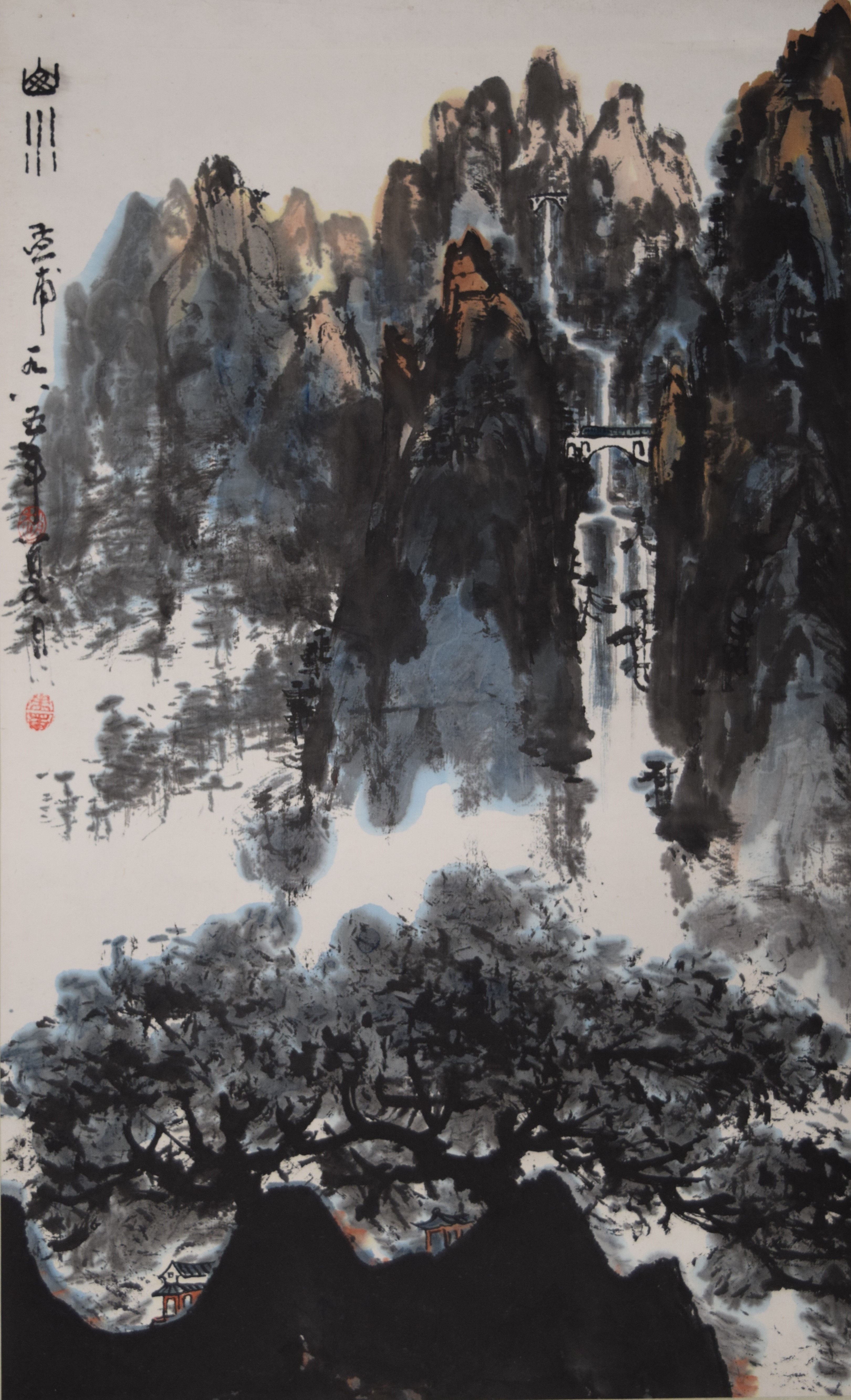 An Oriental watercolour scroll painting of a mountainous scene.