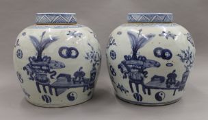 A pair of Chinese blue and white porcelain ginger jars. Each 27 cm high.