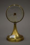 A 1920s C P GOERZ 'mystery' desk barometer, with brass frame and base. 16 cm high.