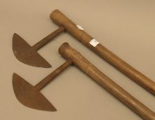 A pair of African tribal throwing axes. The largest 85 cm long.