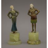 A pair of Art Deco ivory and painted bronze figurines, each mounted on an onyx plinth base.