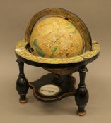 A 20th century terrestrial globe on stand together with a large collection of vintage children's