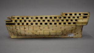 A Napoleonic Prisoner of War bone ship's hull. 38.5 cm long.