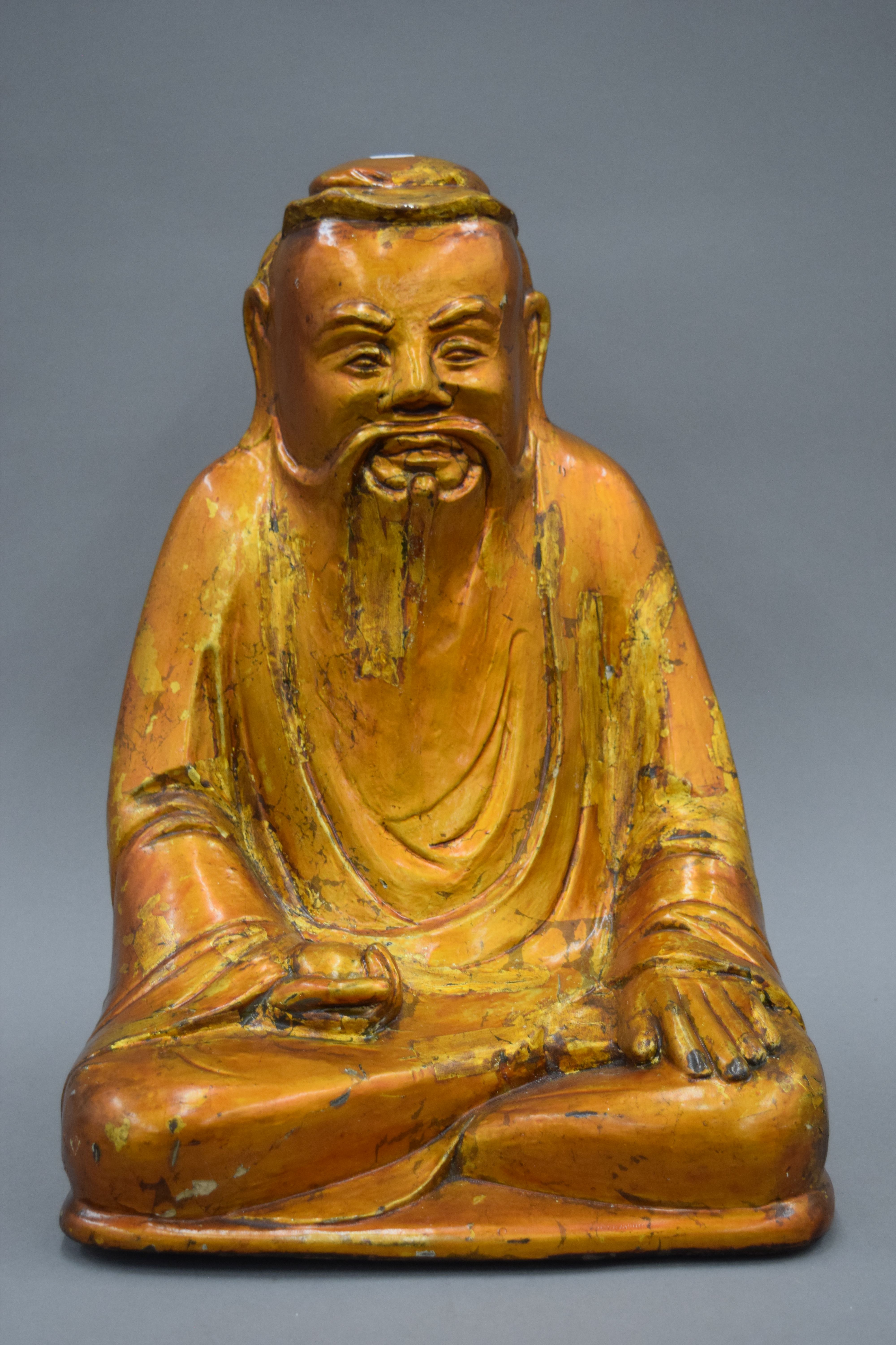 A large 19th century Oriental lacquered carved wooden model of Buddha. 40 cm high.