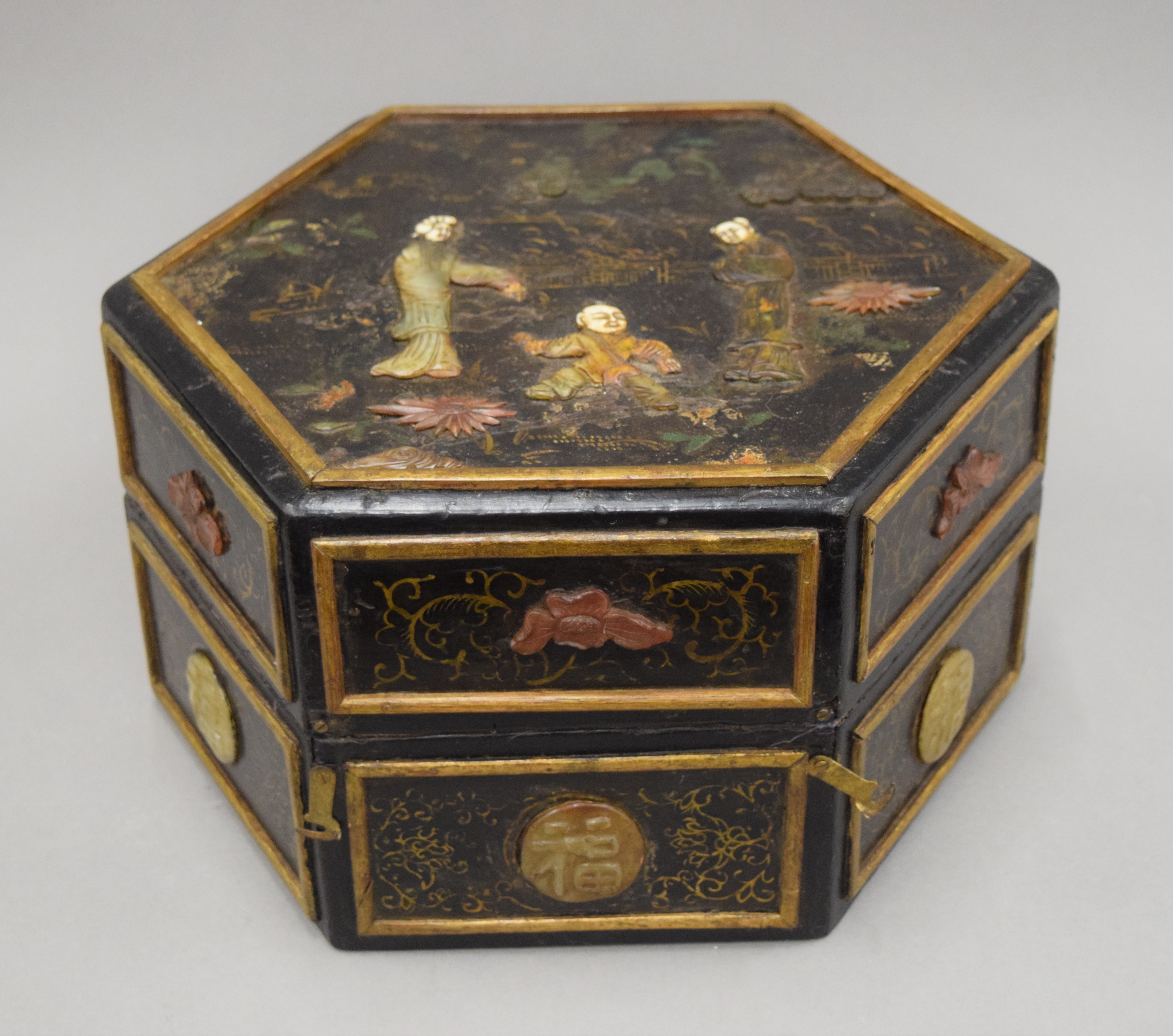 A Chinese hexagonal hardstone mounted and lacquered box. 32 cm wide.