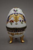 A Limoges porcelain egg form box. 9.5 cm high.