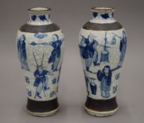 A pair of Chinese crackle glaze blue and white vases. 25 cm high.