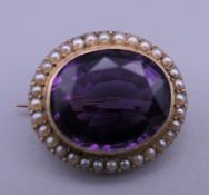 A Victorian amethyst and pearl brooch. 2.2 cm wide. 6.2 grammes total weight.