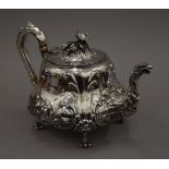 A Victorian Elkington and Co EPNS teapot with flower finial. 17 cm high.