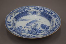 An 18th century Chinese blue and white porcelain dish. 21.5 cm diameter.