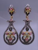 A pair of unmarked gold diamond and tourmaline earrings, with replaced silver backs. Each 5 cm high.