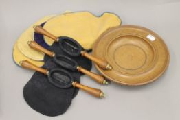 An oak offertory plate, three oak handled offertory pouches, etc.