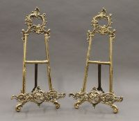 A pair of brass table easels. Each 41 cm high.