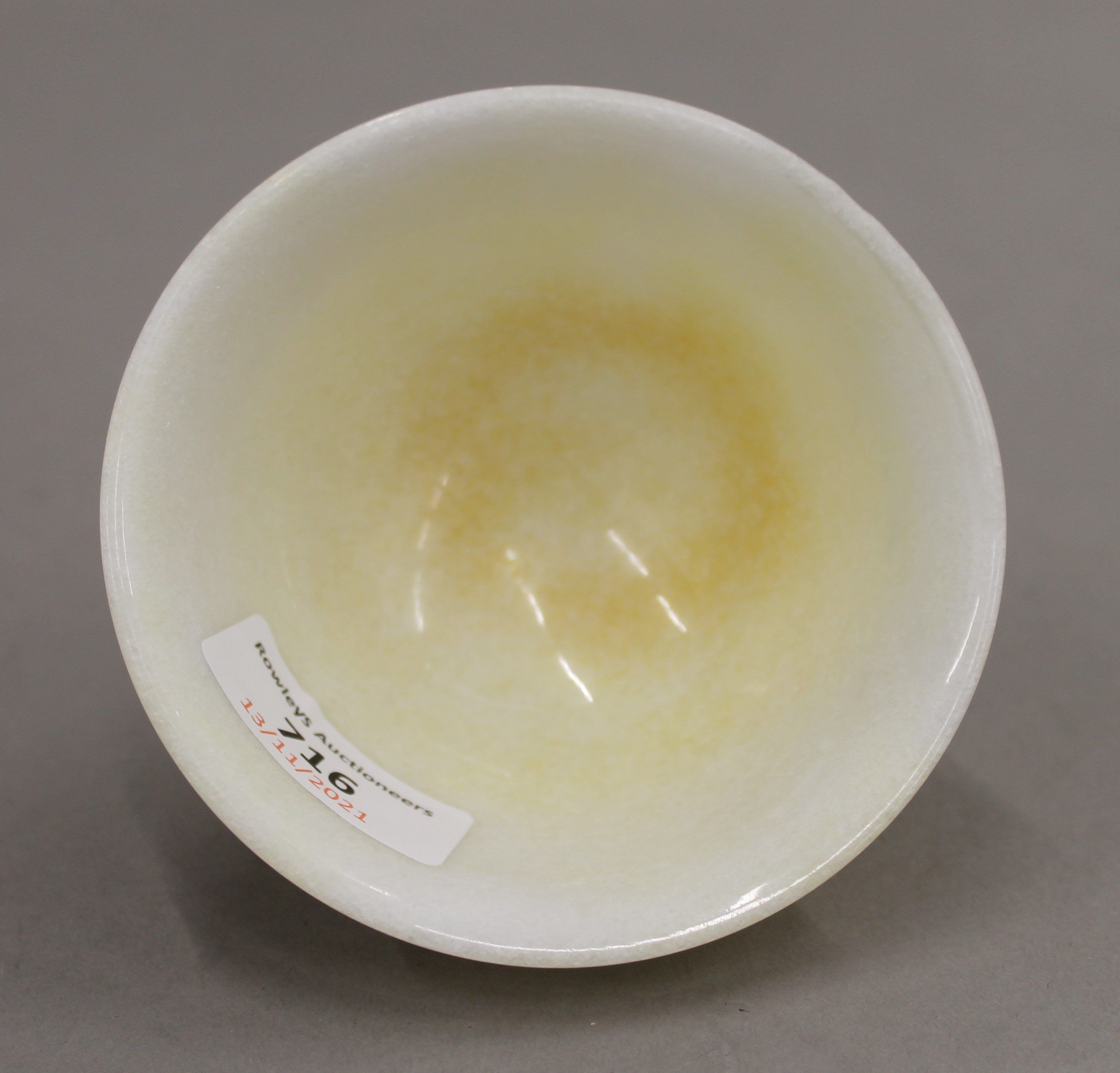 A Chinese turned speckled stone bowl. 10 cm diameter. - Image 3 of 4