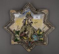 A 19th century star tile profile decoration of a warrior. 29 cm wide.