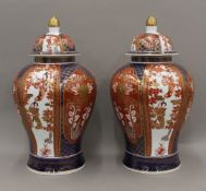 A large pair of modern Imari lidded vases. Each 45 cm high.