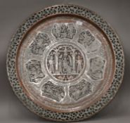 A large silvered copper Persian wall platter. 76 cm diameter.