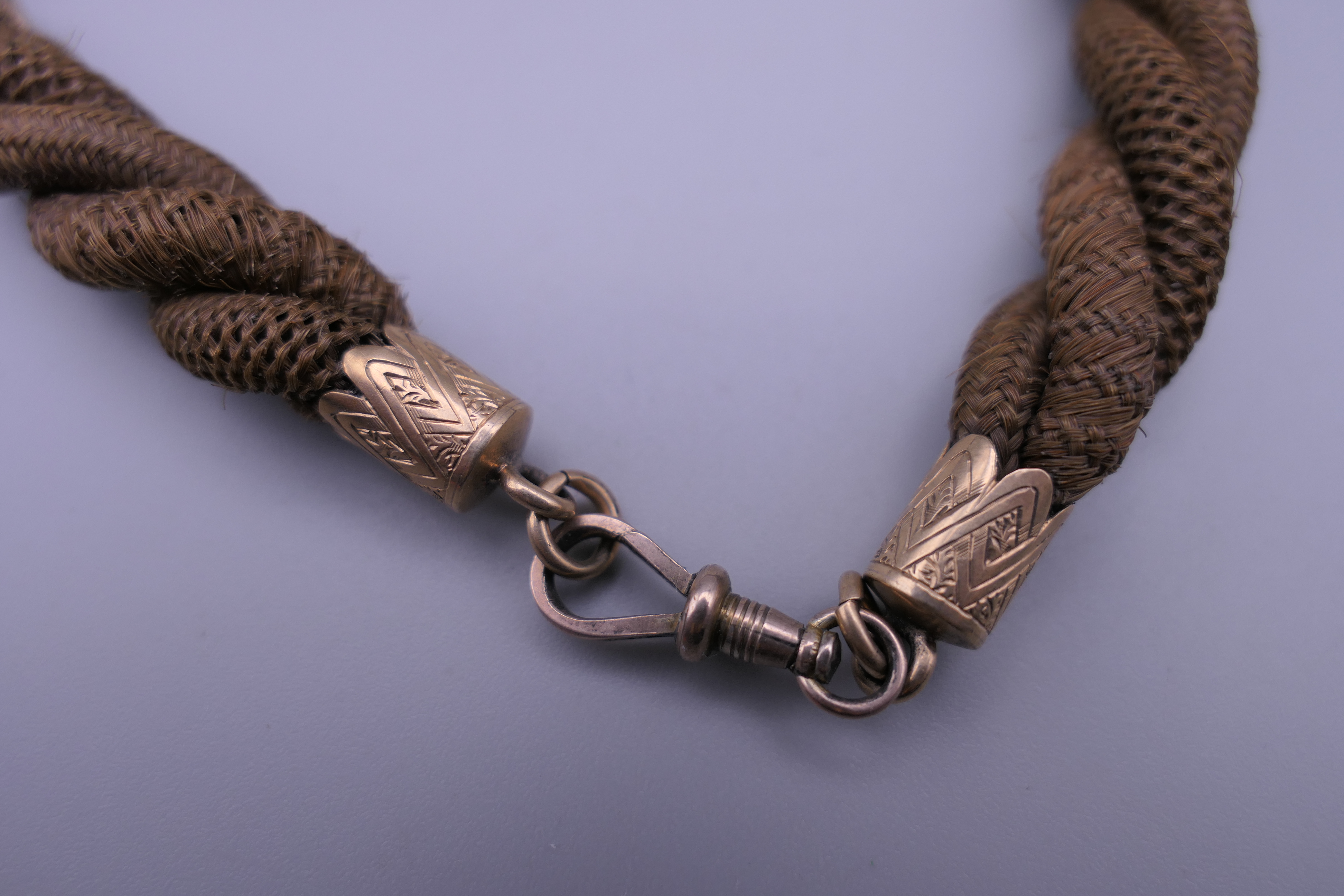 A Victorian 9 ct gold mounted hair twist watch chain. Approximately 36 cm long. - Image 3 of 5