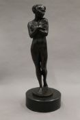 A patinated bronze model of a nude woman. 27.5 cm high.