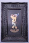 A 19th century pietra dura panel formed as a drinking figure, housed in a carved frame. 17 x 25.