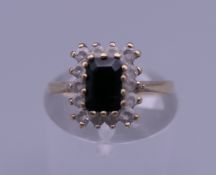 A 9 ct gold sapphire ring. Ring size K. 1.8 grammes total weight.