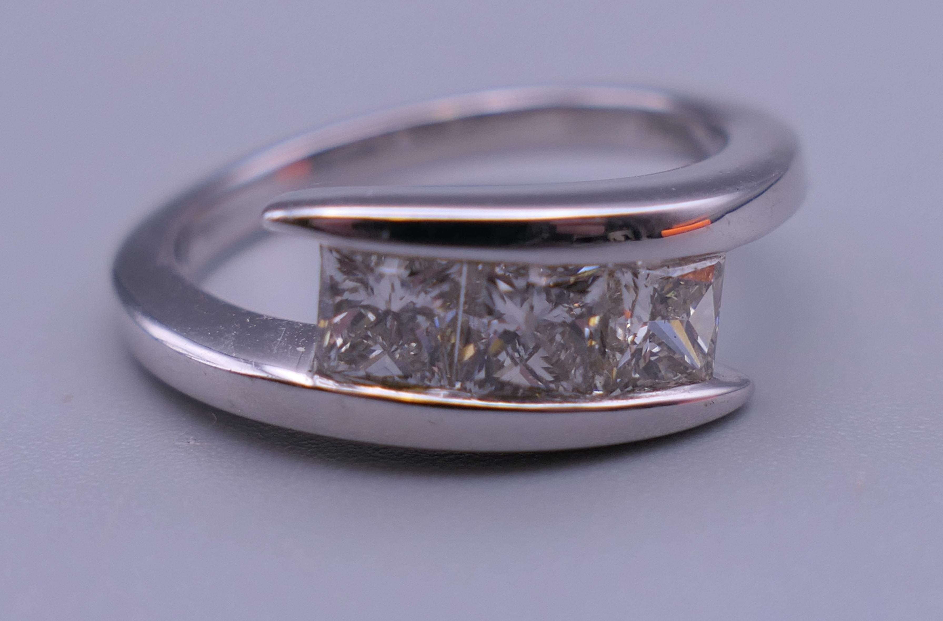 An 18 ct white gold square cut diamond three stone ring. Approximately 1.06 carats of diamond. - Image 5 of 7