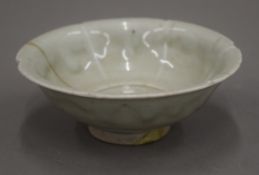 A Song celadon ground pottery bowl. 12 cm diameter.