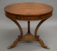 A Regency style brass inlaid centre table. 81 cm diameter.