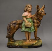 An early 20th century plaster model of a young girl and a dog, entitled 'Good Companions'.